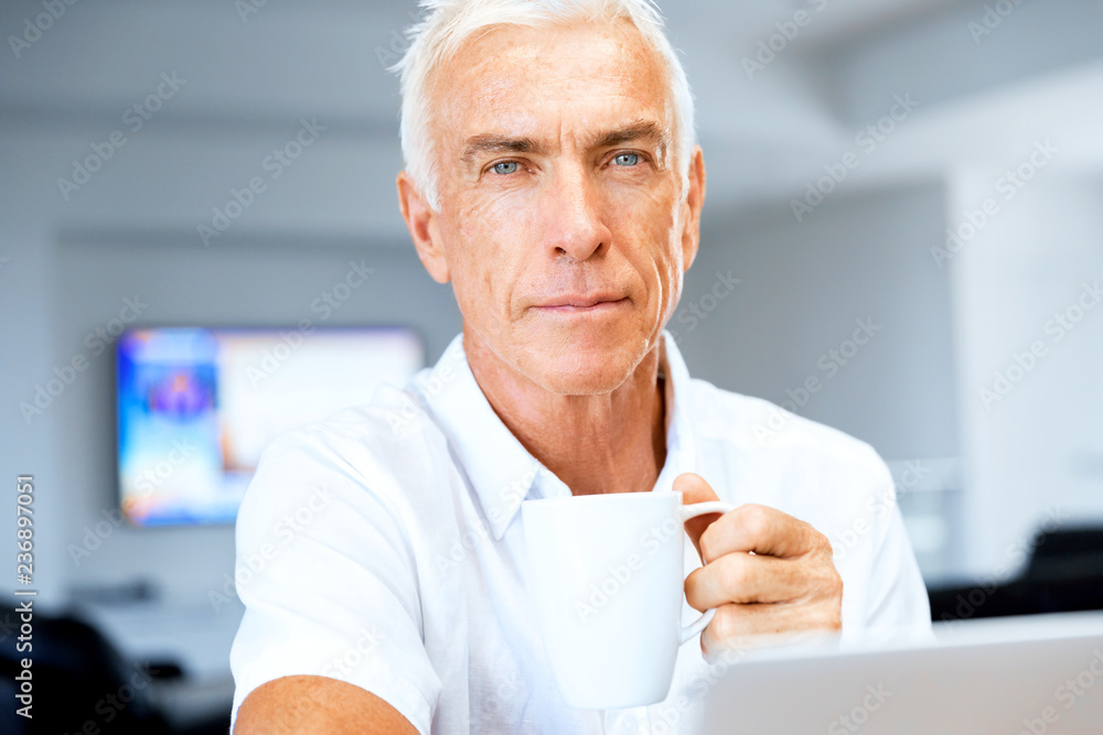 Man working on laptop at home