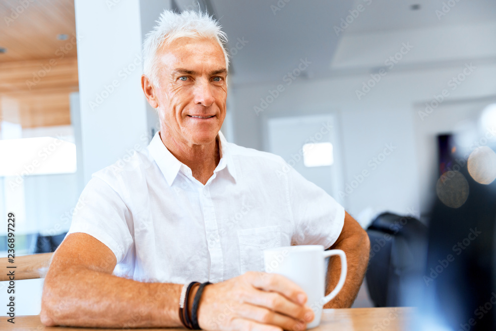 Portrait of a handsome senior man indoor Portrait of a handsome senior man indoor