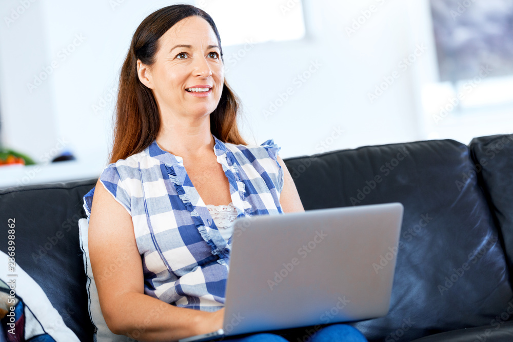 Mature beautiful woman working on her laptop Mature beautiful woman working on her laptop