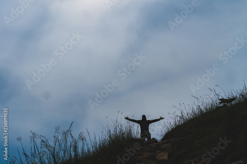 Man rise hands up to sky freedom concept with blue sky.