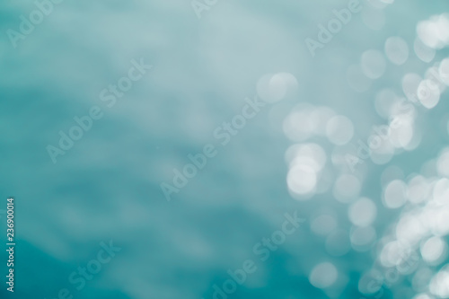 Blur beach with bokeh blue color background.