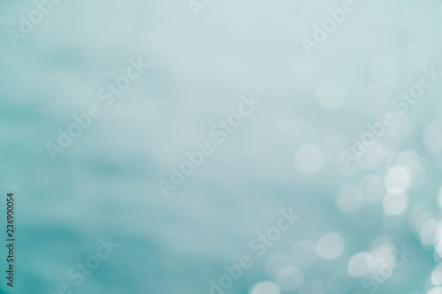 Blur beach with bokeh blue color background.
