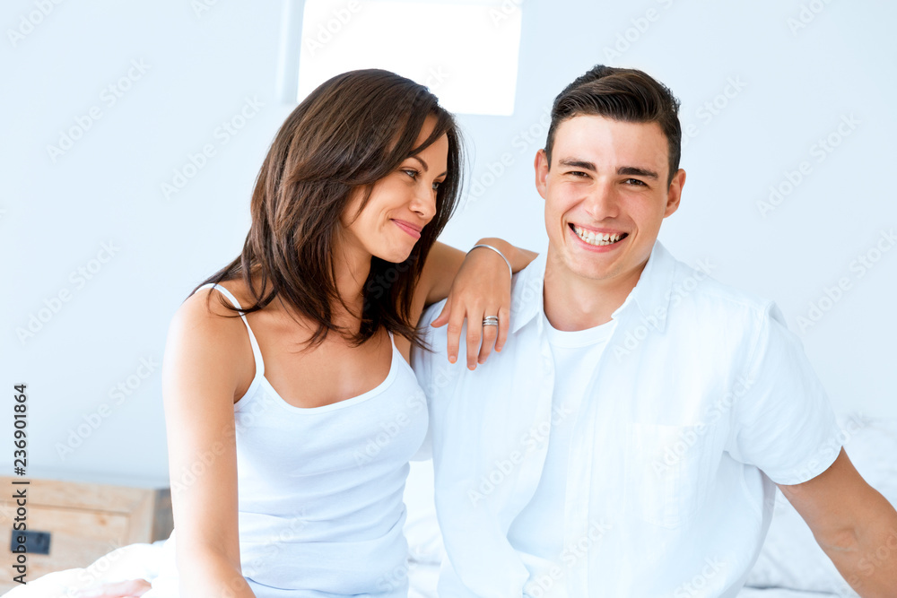 Young happy couple in the bedroom Young happy couple in the bedroom
