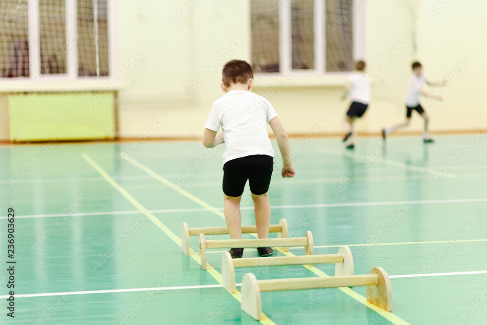 child jumps in the gym