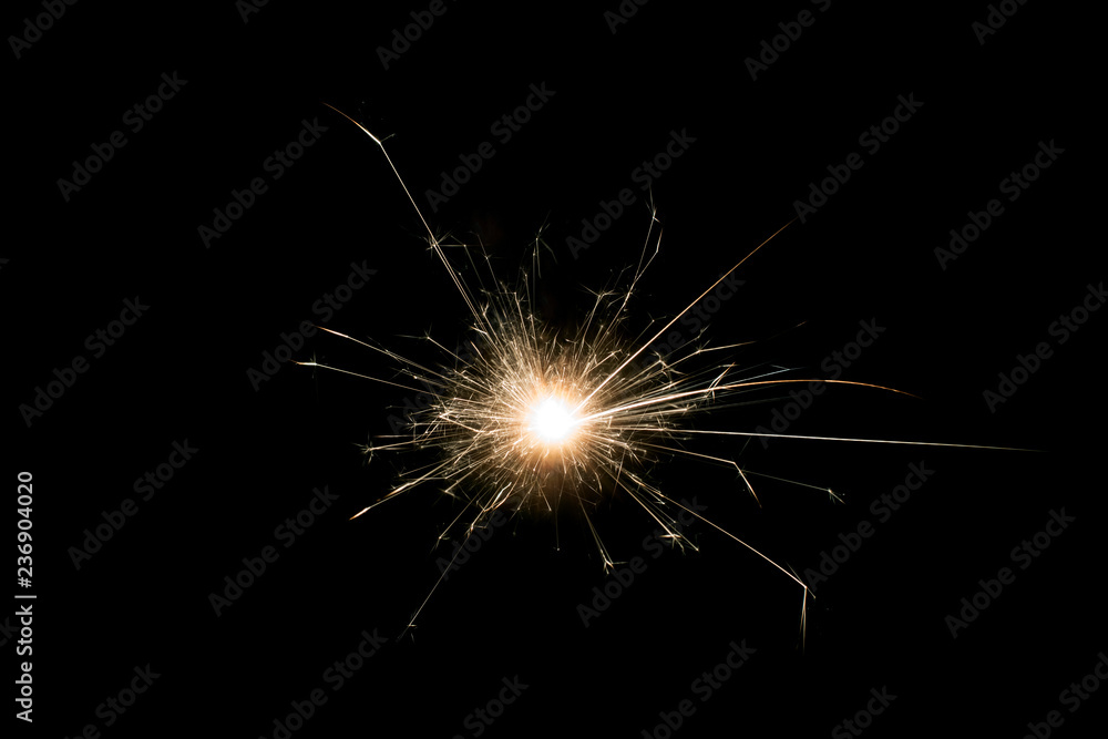 Christmas and new year sparkler decoration on black background.