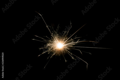 Christmas and new year sparkler decoration on black background.