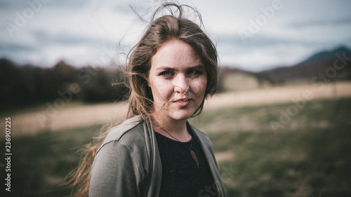 Woman with long hair, blowing in the wind