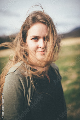 Wind blows woman's long hair