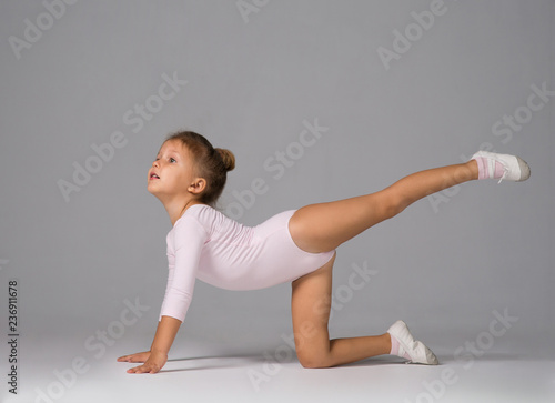 The little girl is engaged in gymnastics photo