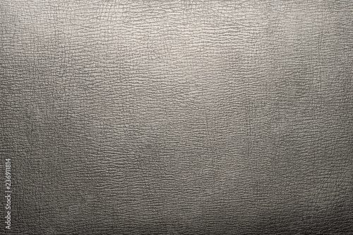 Black leather texture with highlights closeup