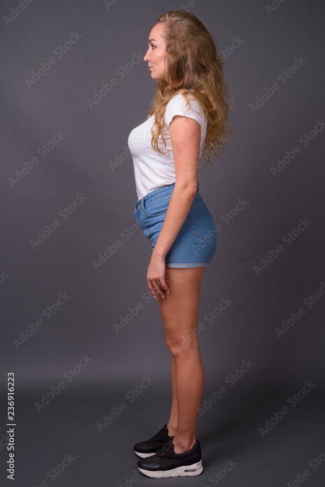 Full length profile view portrait of young beautiful woman Full length profile view portrait of young beautiful woman