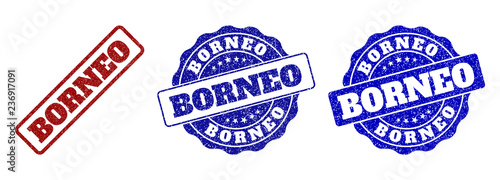 BORNEO scratched stamp seals in red and blue colors. Vector BORNEO labels with dirty effect. Graphic elements are rounded rectangles, rosettes, circles and text labels.