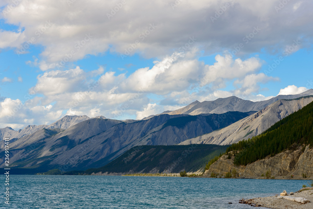 Mountains surrounding the lake at Muncho Lake Provincial Park, British Columbia, Canada Mountains surrounding the lake at Muncho Lake Provincial Park, British Columbia, Canada