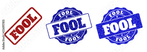 FOOL grunge stamp seals in red and blue colors. Vector FOOL labels with grunge effect. Graphic elements are rounded rectangles, rosettes, circles and text labels. Designed for rubber stamp imitations.