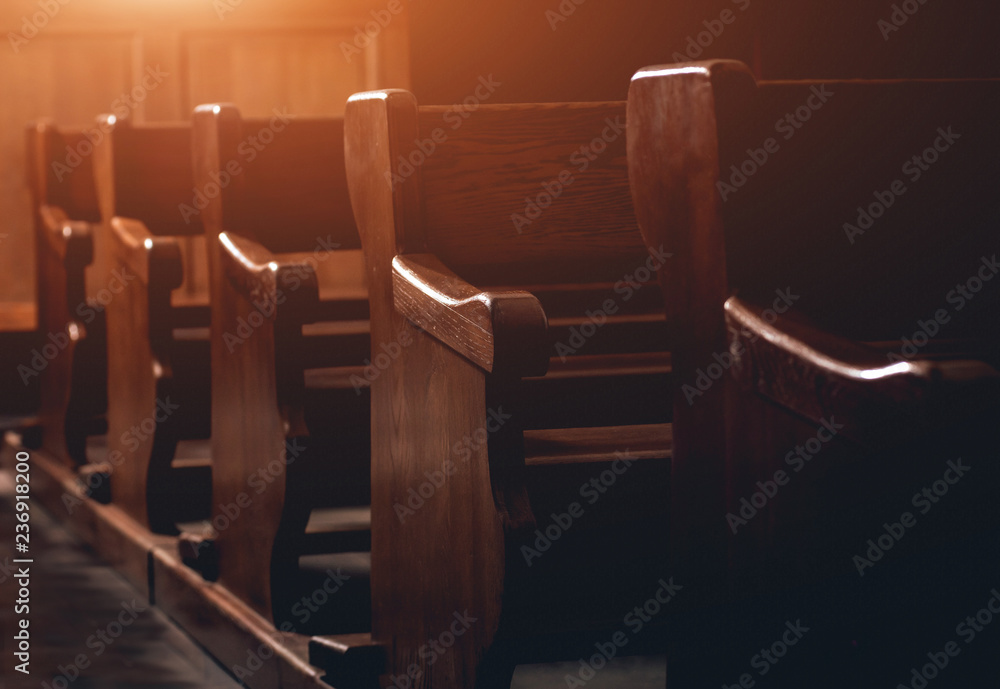 Fototapeta premium Rows of church benches. Selective focus.