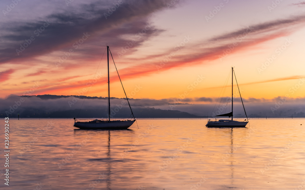 Colours of Sunrise and Low Clouds on the Bay