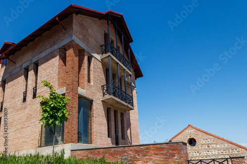 Facade of modern brick house at sunny day