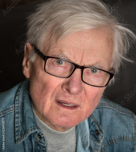 Elderly man with glasses.