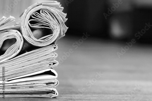 Business news template with stack of newspapers and magazines and empty space (copy space) for text