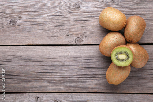Fresh kiwi fruit on grey wooden background