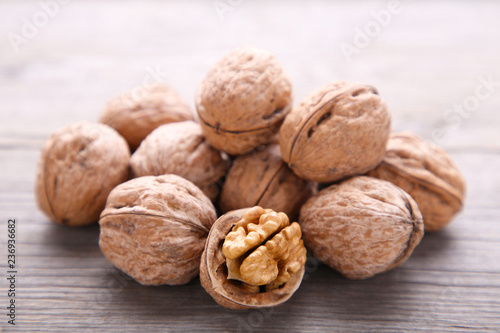 Walnuts kernels on grey wooden background. Walnut healthy food