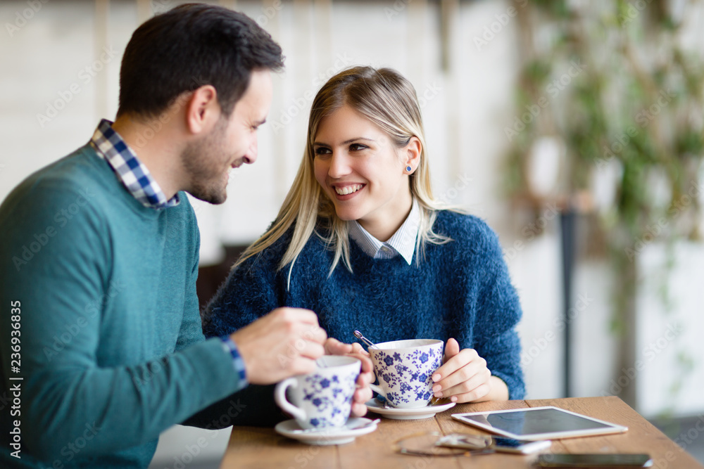 Young attractive couple on date in coffee shop Young attractive couple on date in coffee shop