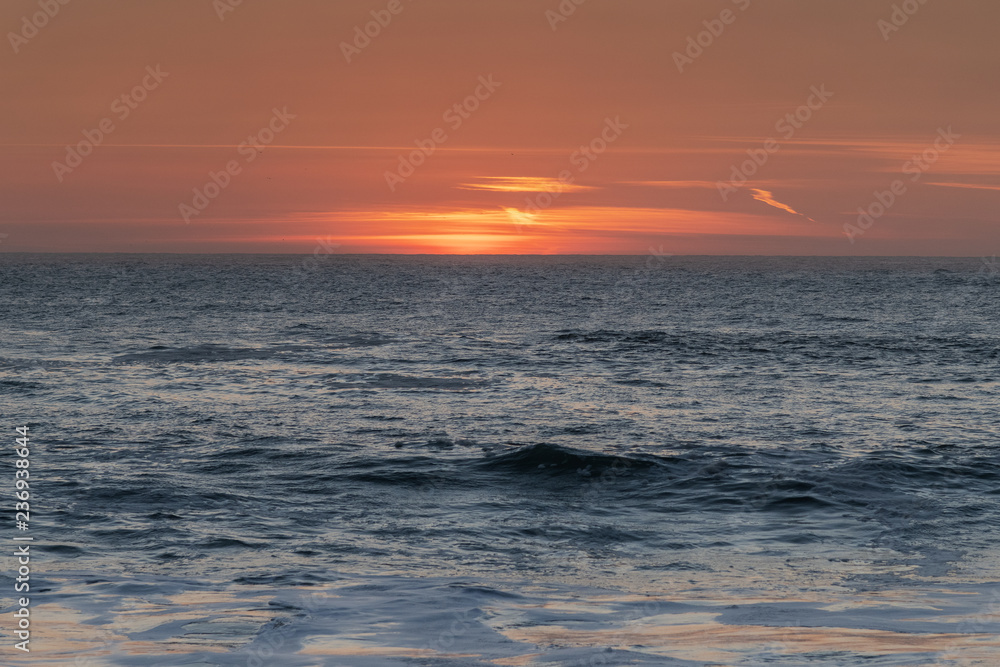 Obraz premium Sunset in Atlantic ocean, Nazare, Portugal.