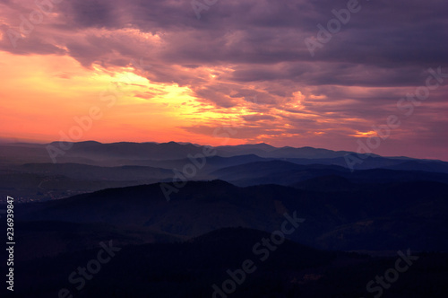 Mountains silhouettes at sunset.