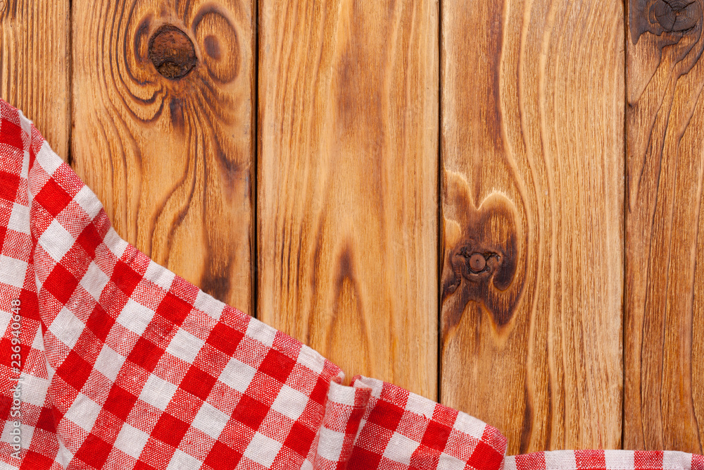 Fototapeta premium checkered tablecloth on wooden table