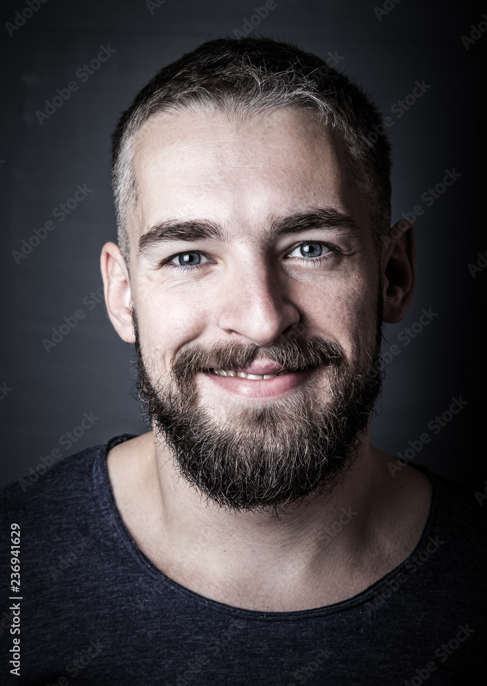 Portrait of a young man with a beard. Toned Portrait of a young man with a beard. Toned