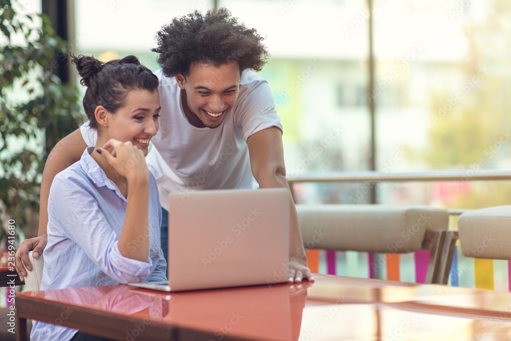 Two freelance working in coffee shop, Nomad worker conceptual, couple work together in cafe with laptop Two freelance working in coffee shop, Nomad worker conceptual, couple work together in cafe with laptop