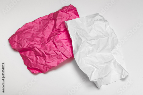 close up of a crumpled paper with curled edge on white background