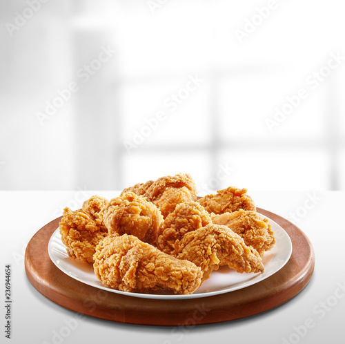 crispy coated batter southern style fried chicken in a wooden table