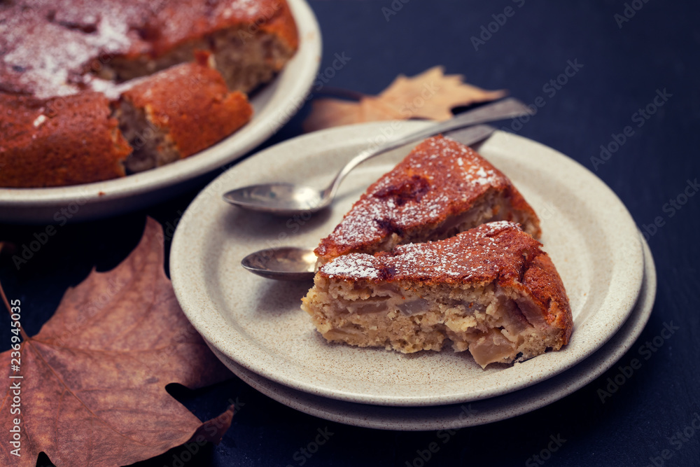 apple pie on dish on black ceramic background apple pie on dish on black ceramic background