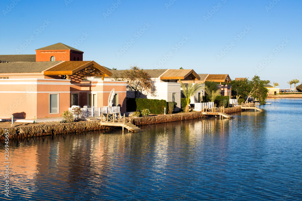 Houses near the water on the canal in El Gouna, Egypt. Houses near the water on the canal in El Gouna, Egypt.