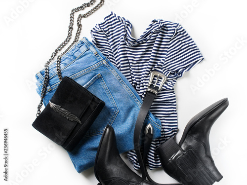 Set of women's outfit - jeans, western boots, bag, belt and striped pullover oversize