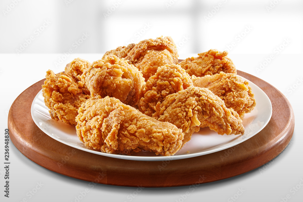 crispy coated batter southern style fried chicken in a wooden table crispy coated batter southern style fried chicken in a wooden table