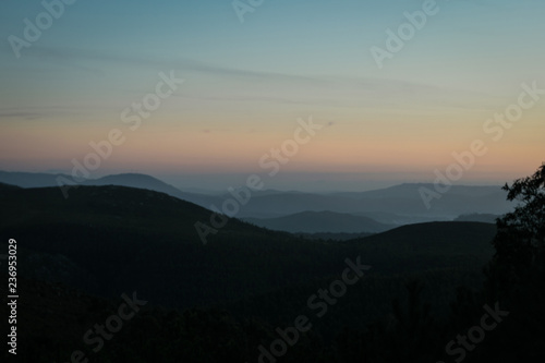 Mist between the mountains at sunset