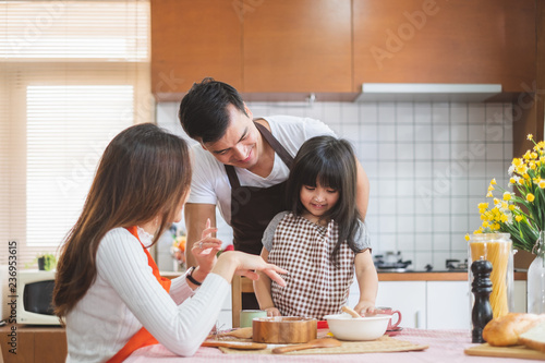 Happy Asian family cooking in kitchen, with happy and smile, lifestyle happy family concept