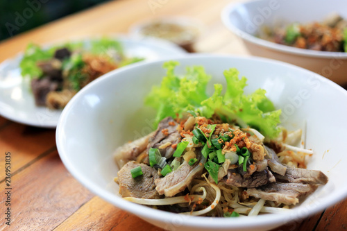 Dry noodle stewed beef with vegetable Thai local street food.
