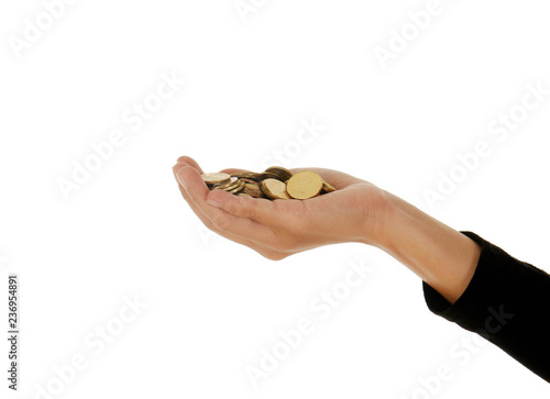 A female hand holding money against a white background