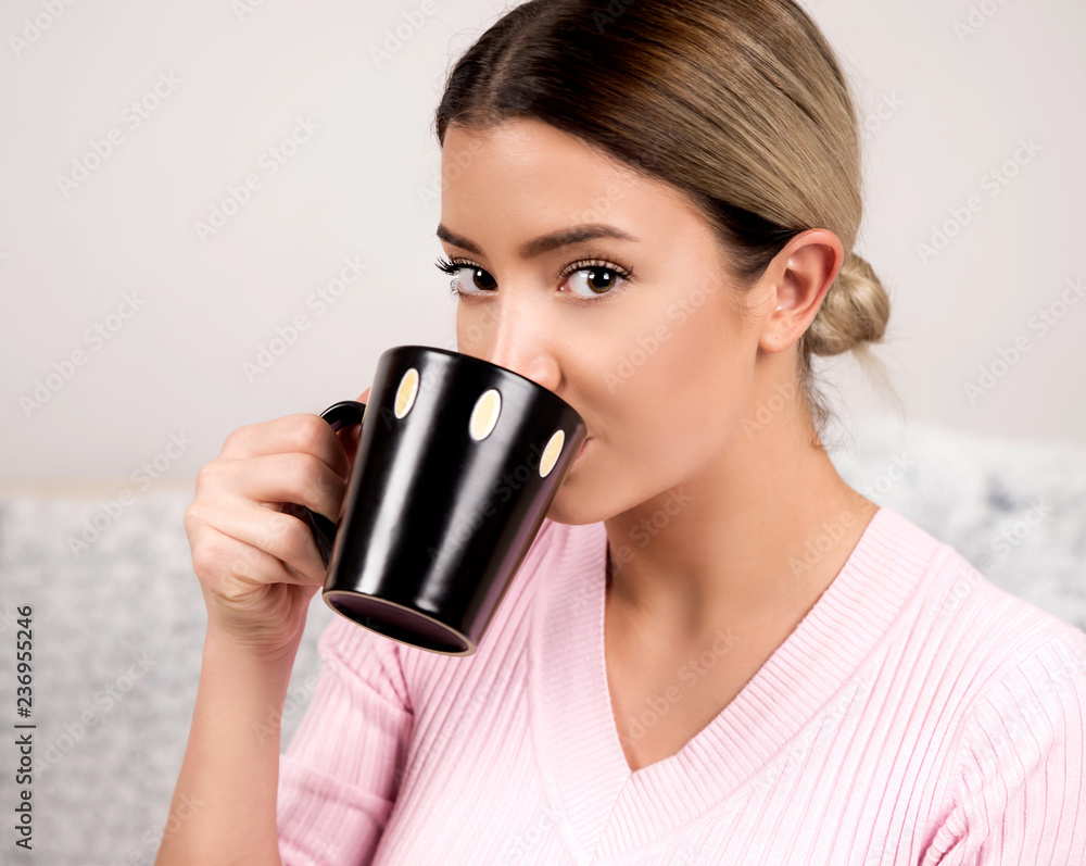 Young woman drinking coffee indoor portrait Young woman drinking coffee indoor portrait
