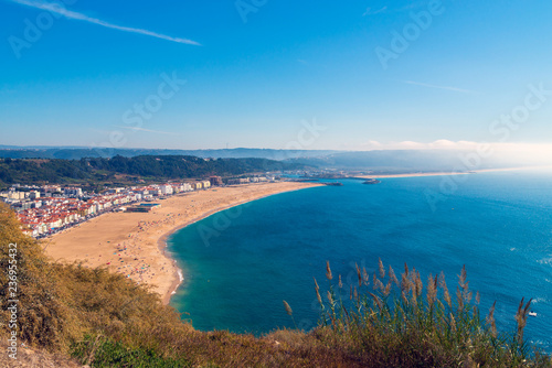 From the high point of the Nazare we can see the beach the sea and the village Nazare, Portugal © rostovdriver