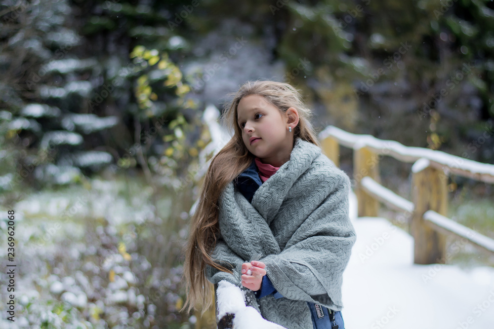portrait of young woman in winter park portrait of young woman in winter park