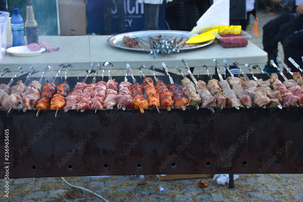 Pork kebab (shashlik) on skewers at barbecue