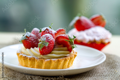 Tasty strawberry cream cake. Pastry. Sweet dessert on a plate