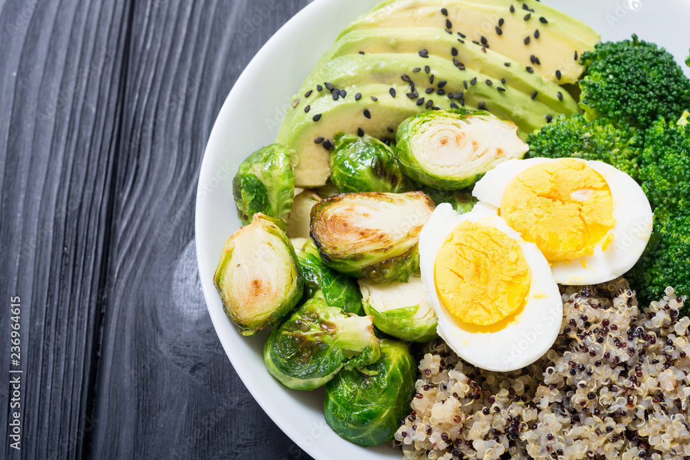 Buddha bowl with quinoa , eggs , avocado , brussels sprouts and broccoli Buddha bowl with quinoa , eggs , avocado , brussels sprouts and broccoli