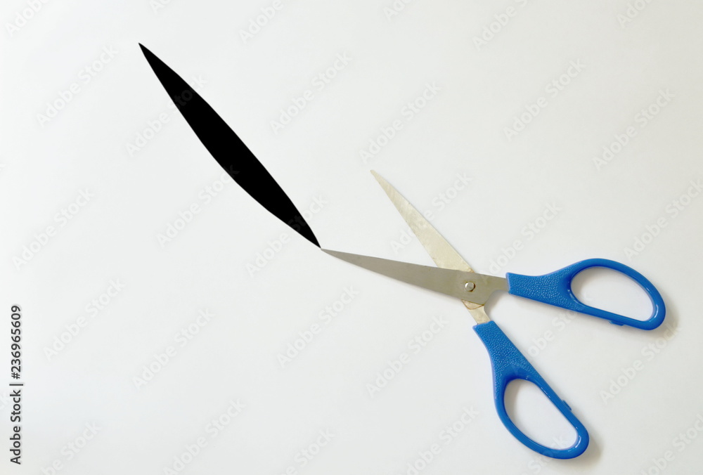scissor with blue handle cutting on white background scissor with blue handle cutting on white background