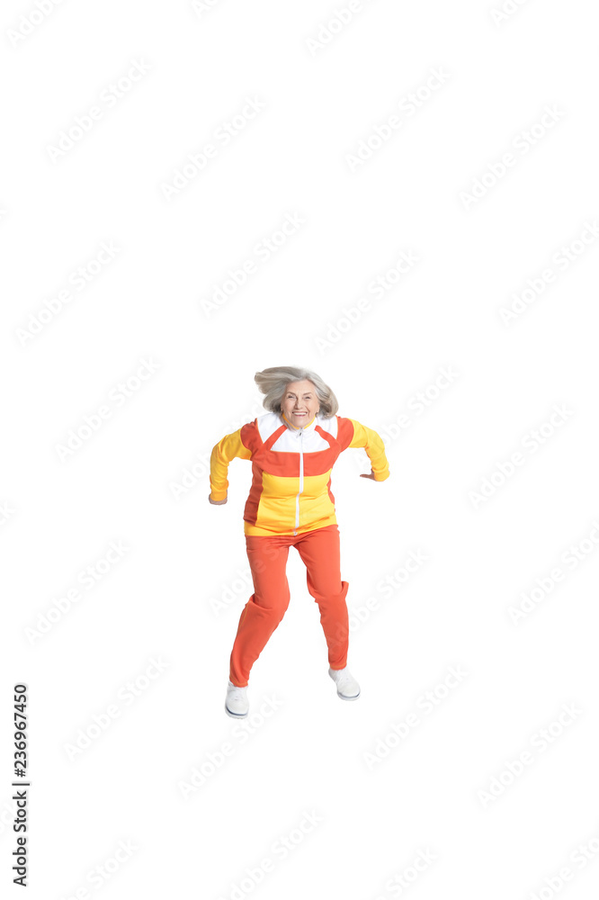Portrait of a senior woman jumping on white background Portrait of a senior woman jumping on white background
