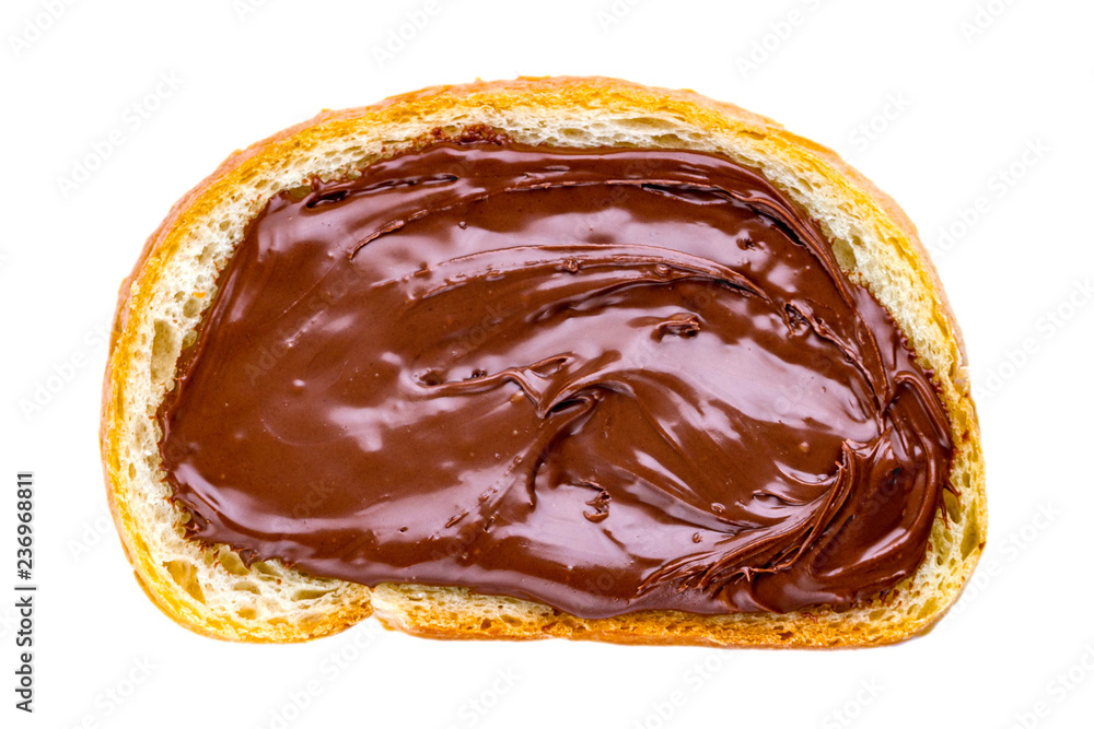 Isolated piece of loaf with spread chocolate paste on a white background. Sweet, nut butter with fresh bread for breakfast. Isolated piece of loaf with spread chocolate paste on a white background. Sweet, nut butter with fresh bread for breakfast.